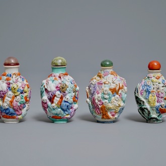Four Chinese famille rose porcelain relief-decorated snuff bottles, 19th C.